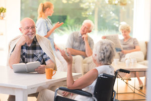 Man talking with disabled woman