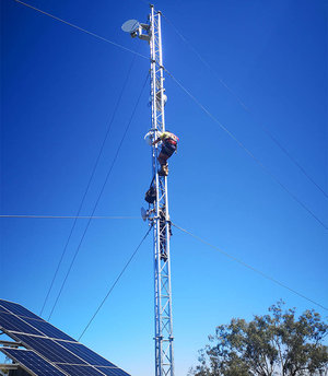 Comtel team member working on microwave tower in Pittsworth